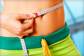 medición de la cintura después del ejercicio para bajar de peso
